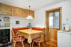 a kitchen with a table and chairs in a room at Stecher's Hüsli in Titisee-Neustadt +28 photos