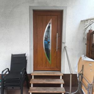 a person standing at the door of a house at Ferienwohnung Seus in Dorfprozelten