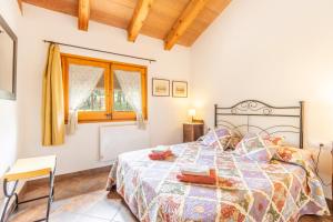 a bedroom with a bed and a window at Casa La Granja in Olvan +15 photos