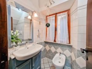 a bathroom with a sink and a mirror at Casa Veronica Rio Marina in Rio Marina