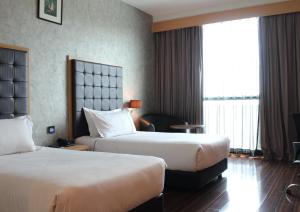 Katil atau katil-katil dalam bilik di Symphony Suites Hotel
