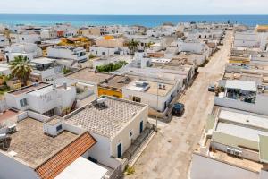 an aerial view of a city with houses at La casetta 462 in Torre San Giovanni Ugento