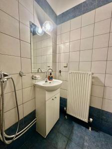 a bathroom with a sink and a shower at Petit City in Orestiada +29 photos