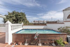 a swimming pool in the backyard of a house at Teror Hills in Teror