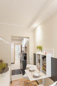 a kitchen and dining room with a table and chairs at Ferienwohnung Baltic in Barth +17 photos