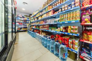 a store aisle with shelves of food and drinks at Kampaoh Conil in Conil de la Frontera