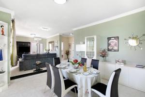 a dining room with a table and chairs at Eveas - Villa with Pool in Tenerife in Candelaria