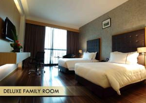 Katil atau katil-katil dalam bilik di Symphony Suites Hotel