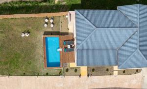 an overhead view of a house with a swimming pool at Sonny 2 Bedroom House in Koukounariá
