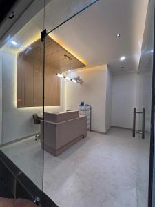 a bathroom with a sink and a counter in a room at Hotel Amora in Dighori Buzurg +1 photo