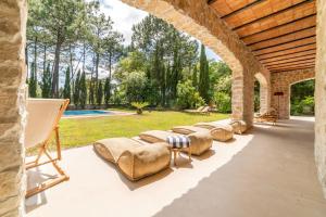 a row of couches sitting on a patio at Villa Alegria in Azeitao