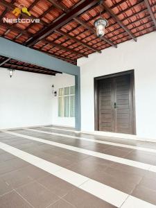 a large empty room with a door and a ceiling at The Single Level Bliss By Nestcove in Malacca
