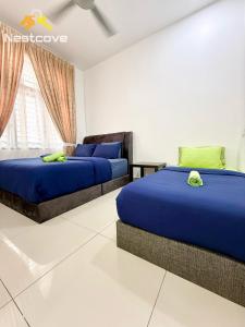 a bedroom with two beds and a window at The Single Level Bliss By Nestcove in Malacca