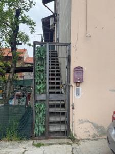 a staircase leading up to a building with a gate at Casa Alma in Cogliate