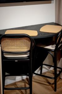 a black desk with a chair and a table at Sunny Hill in Palanga +45 photos