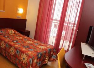 a hotel room with a bed and a window at Meublé Nautic Rooms b&b in Cesenatico