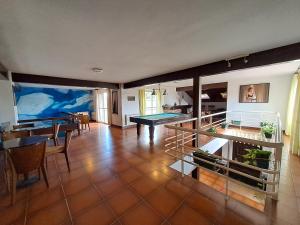 a living room with a ping pong table in it at Hotel Rural & Spa Las Nubes in Albalate de Zorita