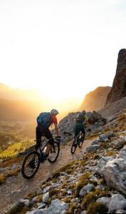 two people riding bikes on a rocky mountain at Green Valley Lodge - Atlas Mountains Nature in Taroudant