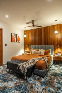 a bedroom with a large bed and a large rug at Perfectstayz Premium Aurevva, Rajpur road in Rājpur