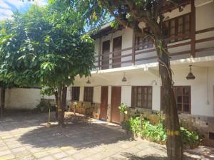 a building with trees in front of it at Solemar in Guarapari