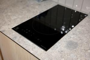a glass window on a counter in a kitchen at Sunny Hill in Palanga