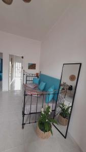 a room with a bunk bed and a couch at Glossy Messinian Escape - Cozy Yard Apartment in Filiatra +6 photos