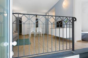 a view through a gate into a room with a table at Bilo Cinema in Bonassola