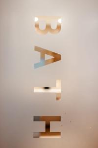 two shelves on a wall in a room at Hotel Derlon in Maastricht +38 photos