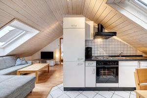 a kitchen and living room in a loft at Weingut Geiger in Meersburg