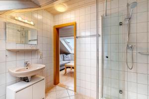 a bathroom with a sink and a shower at Weingut Geiger in Meersburg +142 photos