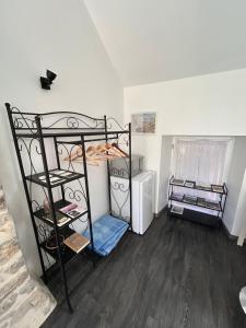 a room with two bunk beds and a refrigerator at Chez Natacha et Adrien in Regnéville-sur-Mer +12 photos