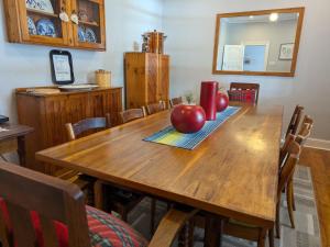 a wooden table with apples on top of it at Mayors Rest on 44 in Uniondale