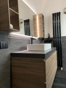 a bathroom with a sink and a counter at attico19 in Montecatini Terme +30 photos