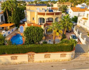 an aerial view of a house with a swimming pool at Villa Vid-Bil Calpe in Calpe