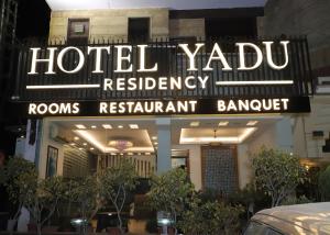 a sign for a hotel yoda restaurant at Hotel Yadu Residency in Meerut