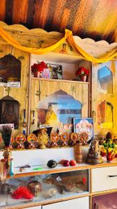 a shelf filled with lots of food and other items at Dolma Homestay By Orko in Nachar