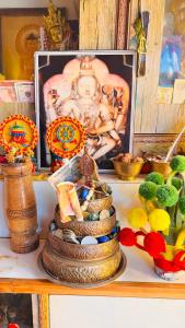 a picture of a statue of a deity on a shelf at Dolma Homestay By Orko in Nachar +37 photos