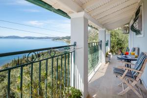 a balcony with a view of the ocean at SeaView Calypso in Nisaki