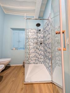 a shower with a glass door in a bathroom at Borgo Mare in Piombino +27 photos