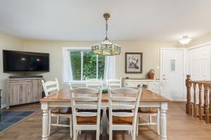 a dining room with a table and chairs at Ideal getaway - Ideal retreat in Lac-Brome
