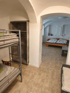 a room with bunk beds and a room with two beds at Jüstel apartment in Litoměřice