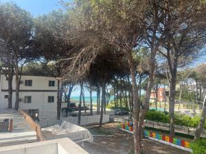 a group of trees with the ocean in the background at ApartHotel XH in Golem