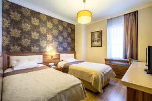 Postel nebo postele na pokoji v ubytování My Rose Hotel