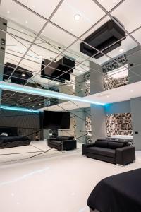 a room with a bed and a tv in it at Hotel Art Village in Casoria