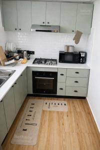 a kitchen with a pizza box on the floor at Kisii cottage in Kisii