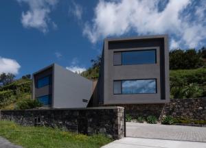 a house on the side of a hill at Chez Nous I e II in Caloura