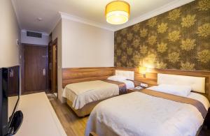 Postel nebo postele na pokoji v ubytování My Rose Hotel