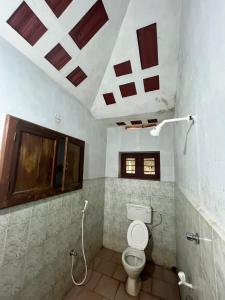 a bathroom with a toilet in a room at Gravity Groups SSK - Near Sangamithra Jipmer in Puducherry Airpoert +35 photos