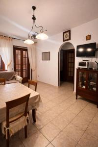 a living room with a table and a couch at La Casa Serena in Scalea