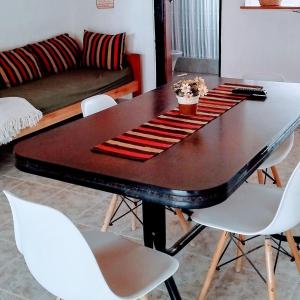 a dining room table with a keyboard on top of it at Complejo Enjoy in Las Grutas